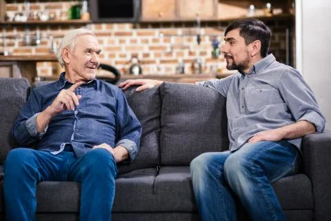 Wise man talking with his son Stock Photos
