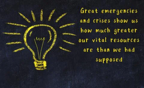 Wise quotation and a chalk drawing of a bulb on black chalkboard Photos