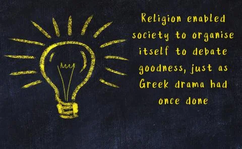 Wise quotation and a chalk drawing of a bulb on black chalkboard 写真素材