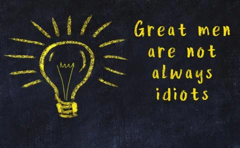 Wise quotation and a chalk drawing of a bulb on black chalkboard Stock Photos