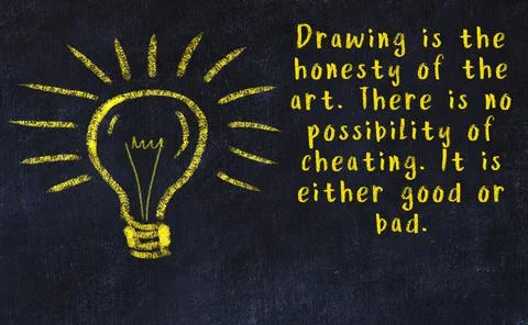 Wise quotation and a chalk drawing of a bulb on black chalkboard Stock Photos