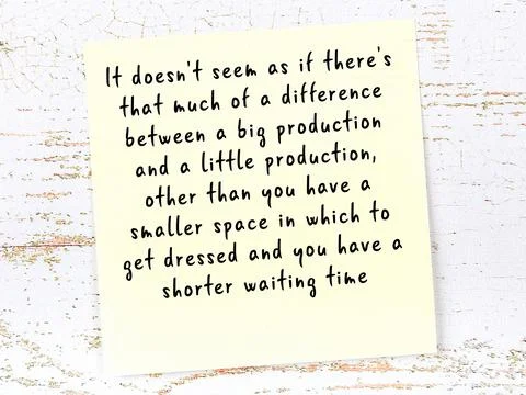 Wise quotation handwritten on yellow sticky note hanging on wooden wall Stock Photos