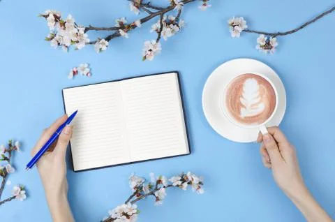 Wish list for future plans. flat lay composition with flowers,notepad and cof Stock Photos
