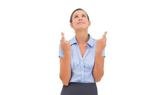 Wishing businesswoman with fingers crossed Stock Photos