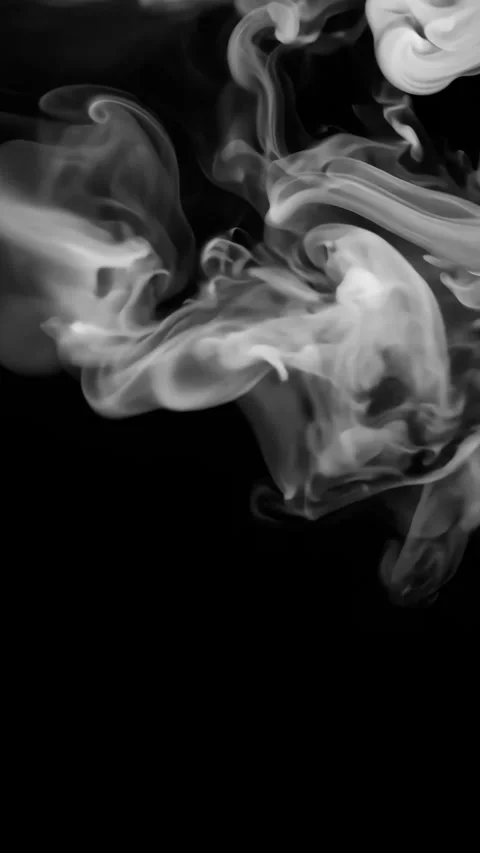 Wisping white smoke curling dynamically, forming ethereal patterns against deep Stock Footage 310778582