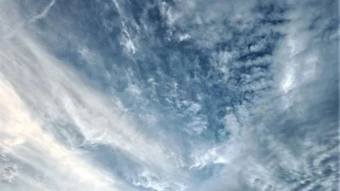 Wispy Cirrus Clouds in Blue Sky Stock Photos