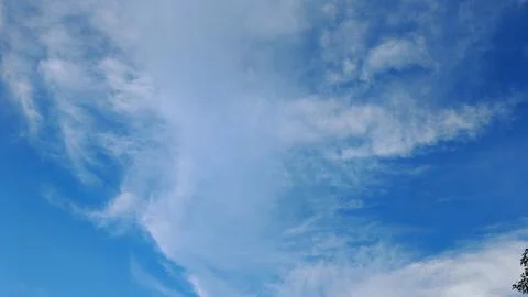 Wispy Cirrus Clouds in Bright Blue Sky Stock Photos