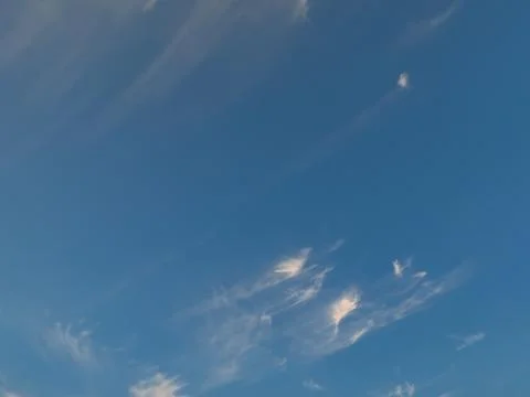 Wispy Cirrus Clouds in a Clear Blue Sky Stock Photos