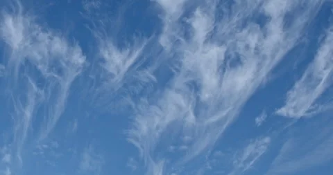 Wispy Cirrus Clouds in a Deep Blue Sky Timelapse Stock Footage 301095783