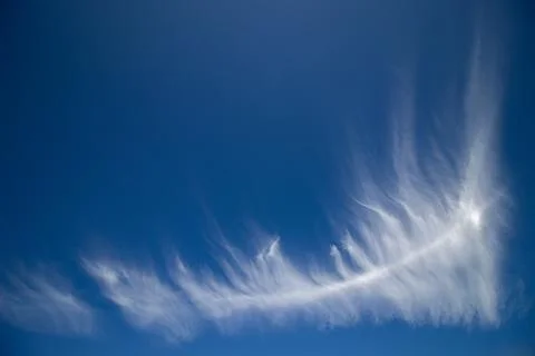 Wispy Cirrus Clouds in a Deep Blue Sky Stock Photos