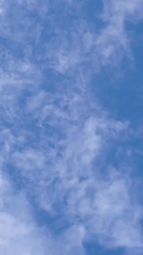 Wispy Cirrus Clouds Flowing Across Blue Sky Stock Footage 346396740