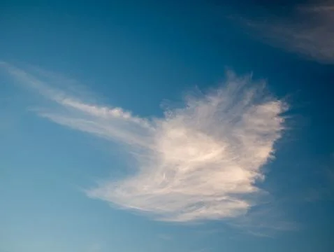 Wispy Cloud Formation in Blue Sky 写真素材