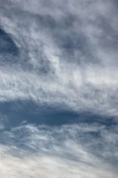 Wispy Clouds Against a Blue Sky 스톡 사진