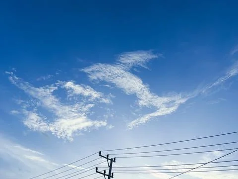 Wispy Clouds in a Blue Sky Stock Photos