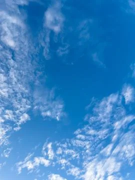 Wispy Clouds in a Blue Sky Фото