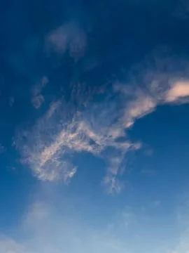 Wispy Clouds in a Bright Blue Sky Stock Photos