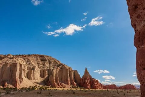 Wispy clouds hovering over monolith and spire Kodachrome Basin Utah Stock Photos