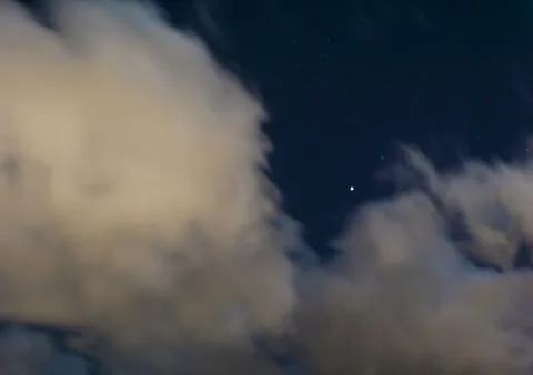 Wispy Clouds in the Night Sky Stock Photos