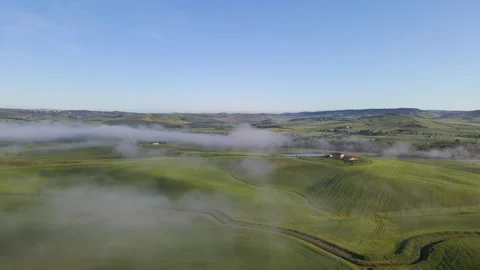 Wispy Clouds Over Green Rolling Hills In The Countryside Of Tuscany, Italy Stock Footage 336695952