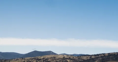 Wispy Few Clouds Blue Sky Timelapse Over Mountains 4K Stock-Footage 113939987