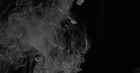 Wispy strands of white ink react to the water to create a unique environment Stock-Footage 68514469