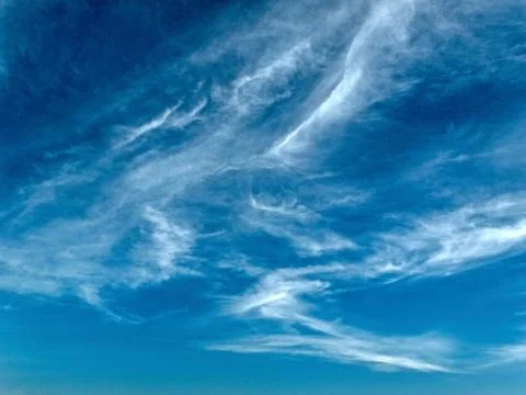 Wispy white Cirrus Cloud. Stock Photos