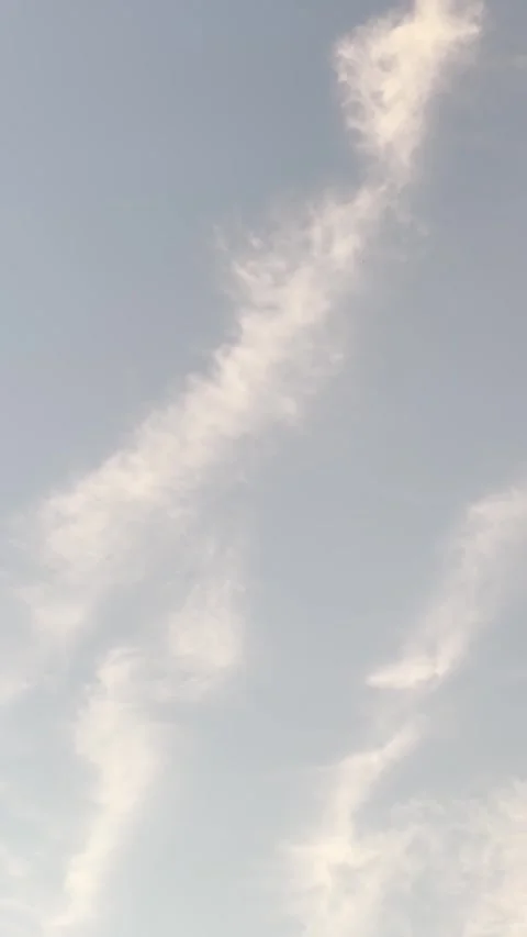 Wispy White Cloud Formation Across a Clear Blue Sky Stock Footage 342830559