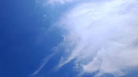 Wispy Wisps of Cirrus Clouds in Deep Blue Sky Stock Photos