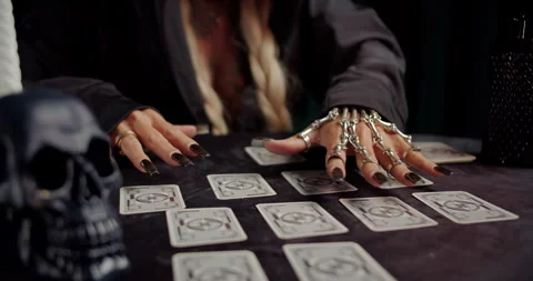 Witch arranging tarot cards during mystical ritual Stock Footage 319601774