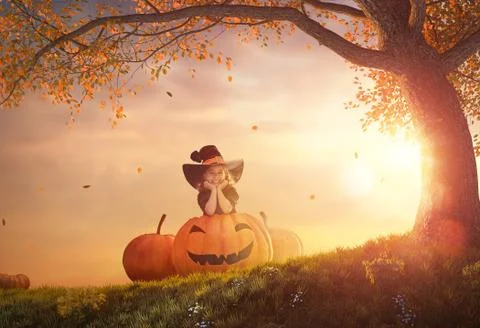 Witch with a big pumpkin Stock Photos