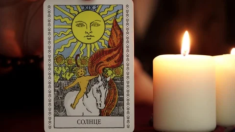 A witch in black robe show tarot card. Occult, esoteric and wicca concept. Stock Footage 108013602
