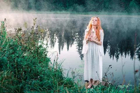 Witch with a candle Stock Photos