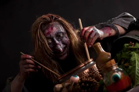 Witch cooks in the witch's kitchen Stock Photos