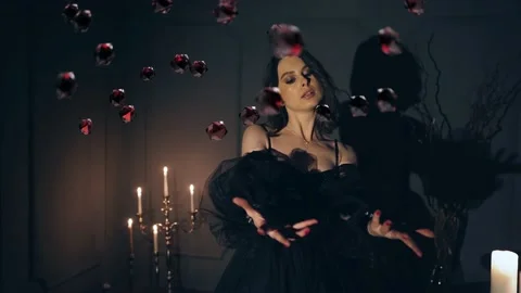 The witch in the dark room with candles lights moves the crystals. 3d animation Stock Footage 239267974