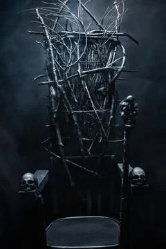 Witch evil throne with skulls and cane. Stock Photos