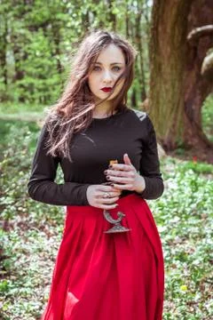 Witch in the forest with a candle Stock Photos
