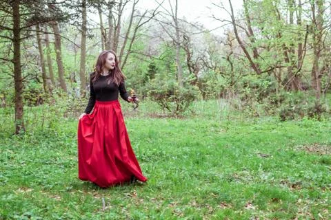 Witch in the forest with a candle Stock Photos