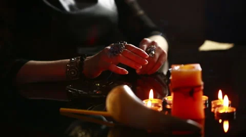 Witch - fortune teller with candles close up. magic ritual. divination Stock Footage 64711131
