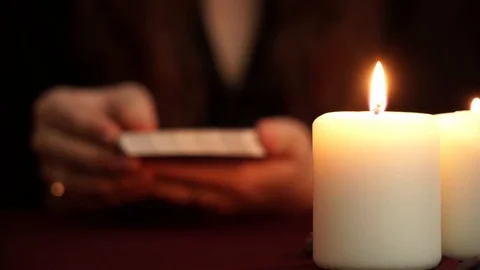 A witch is fortune teller in mantle shows tarot card. Divination, wicca concept. Stock Footage 108013557