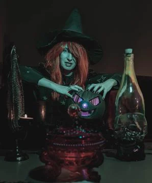 Witch with Halloween Pumpkin Doing Magic Stock Photos