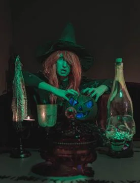 Witch with Halloween Pumpkin Doing Magic Stock Photos