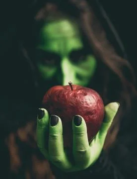 Witch hand with apple 写真素材