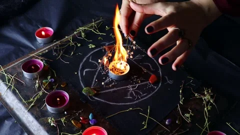 Witch hands burning herbs for a black ritual with the help of magical altar Stock Footage 242773854