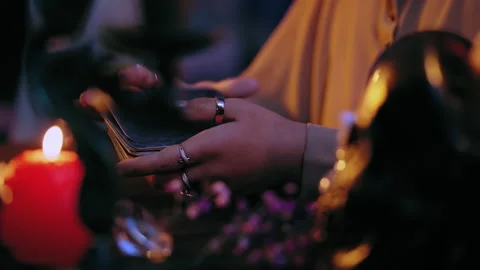 Witch hands shuffling tarot cards, ready to forecast future for client, ritual Stock Footage 201330823