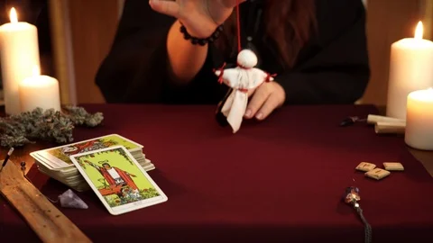 Witch hold voodoo doll with red threads. Magical ritual. Esoteric concept. Stock Footage 108012034