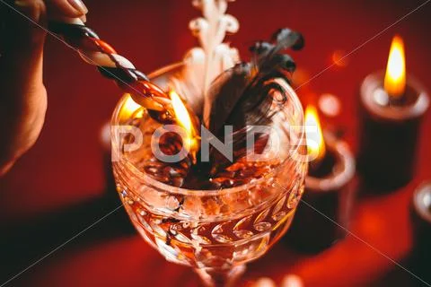 Witch holds candle divination Stock Photos