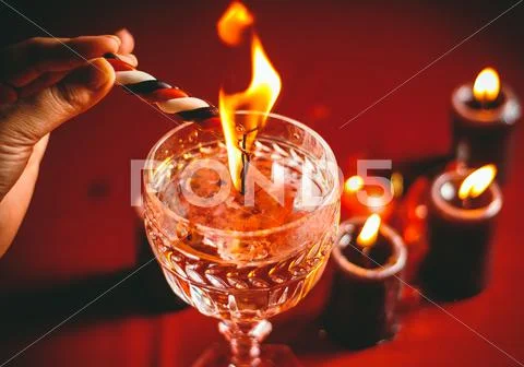 Witch holds candle divination Stock Photos