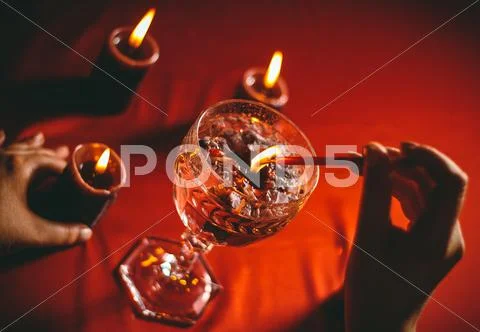 Witch holds candle divination Stock Photos