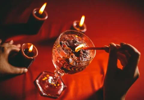 Witch holds candle divination Stock Photos