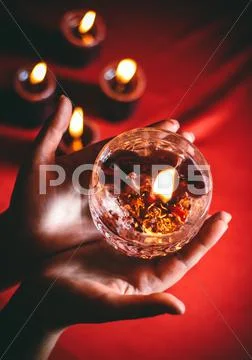 Witch holds candle divination Stock Photos
